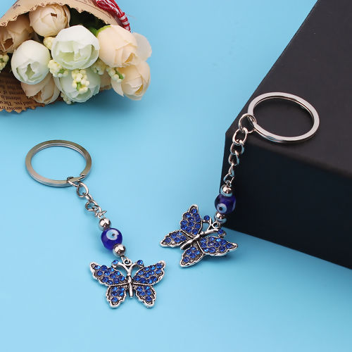 Image de Porte-Clés Papillon Argent Vieilli Œil Mauvais à Strass Bleu 11cm x 3cm, 1 Pièce